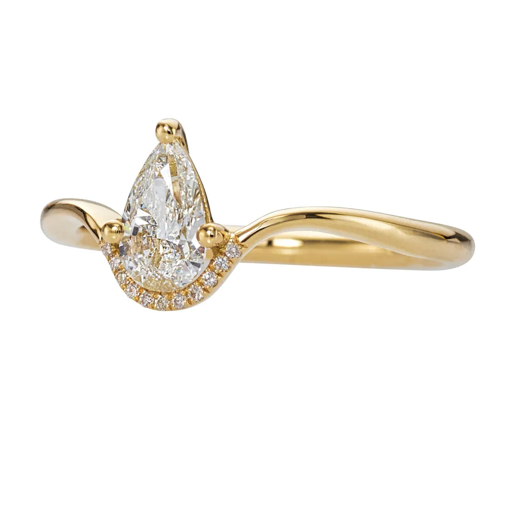 Floating Pear Cut Diamond Engagement Ring in a Classic Style