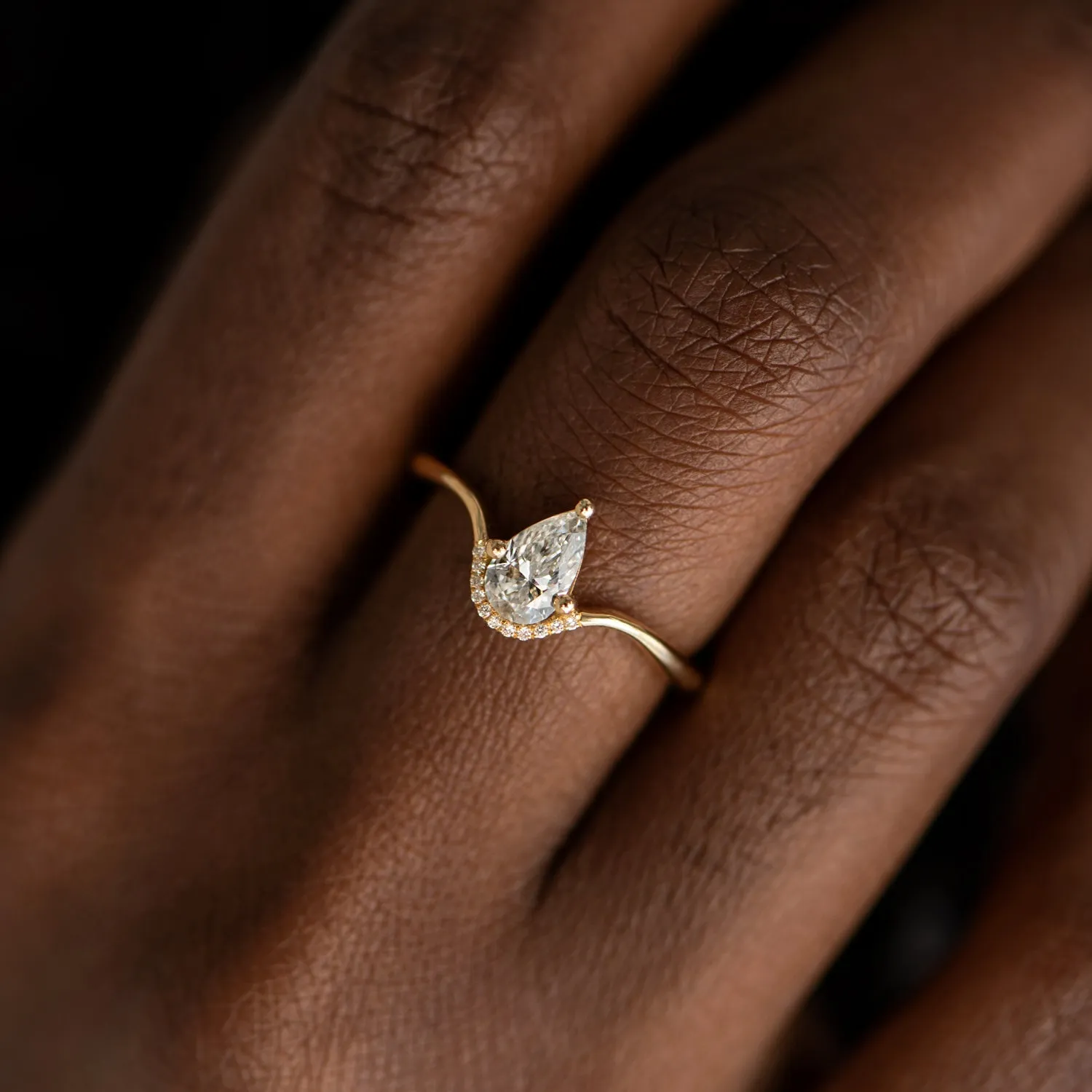 Floating Pear Cut Diamond Engagement Ring in a Classic Style