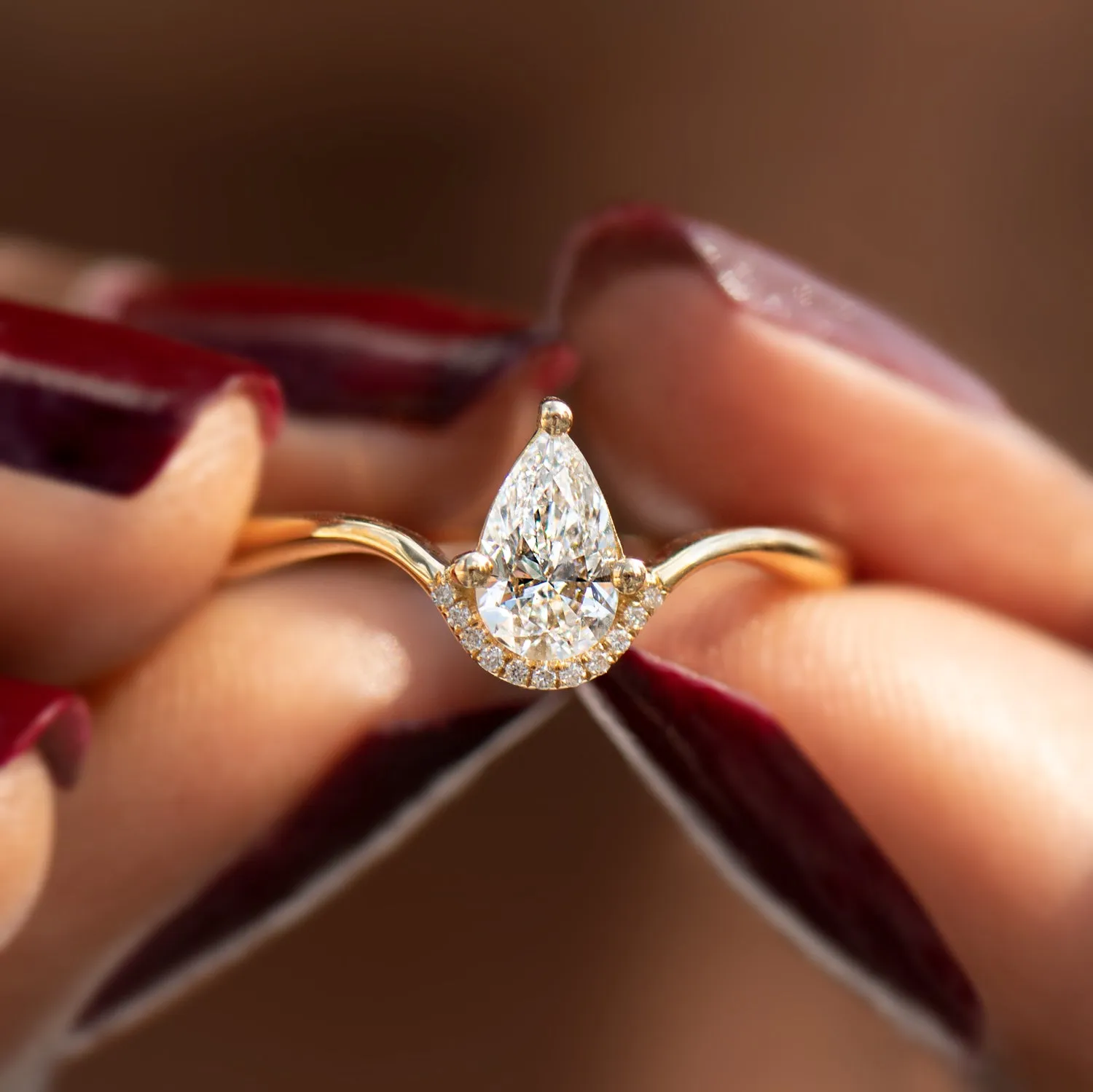 Floating Pear Cut Diamond Engagement Ring in a Classic Style