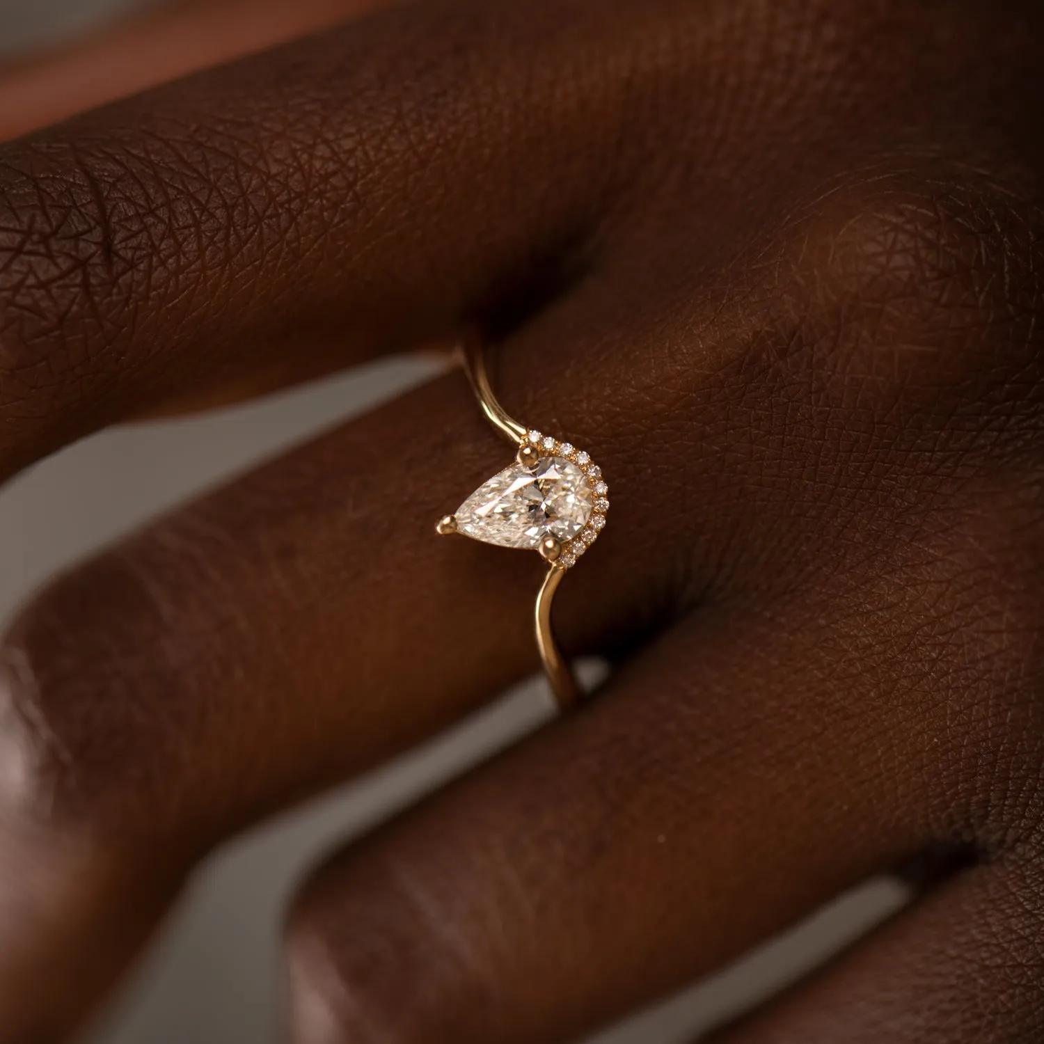 Floating Pear Cut Diamond Engagement Ring in a Classic Style