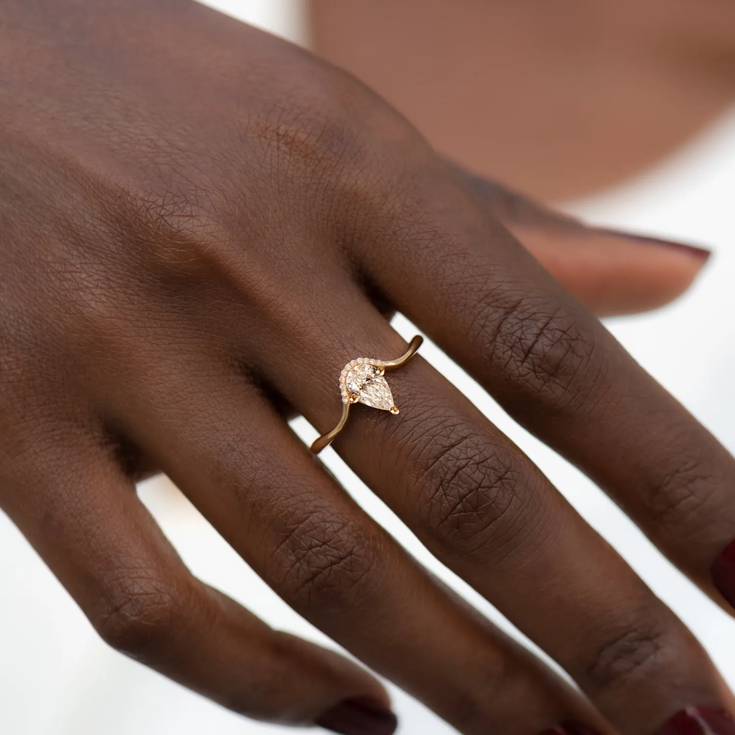 Floating Pear Cut Diamond Engagement Ring in a Classic Style